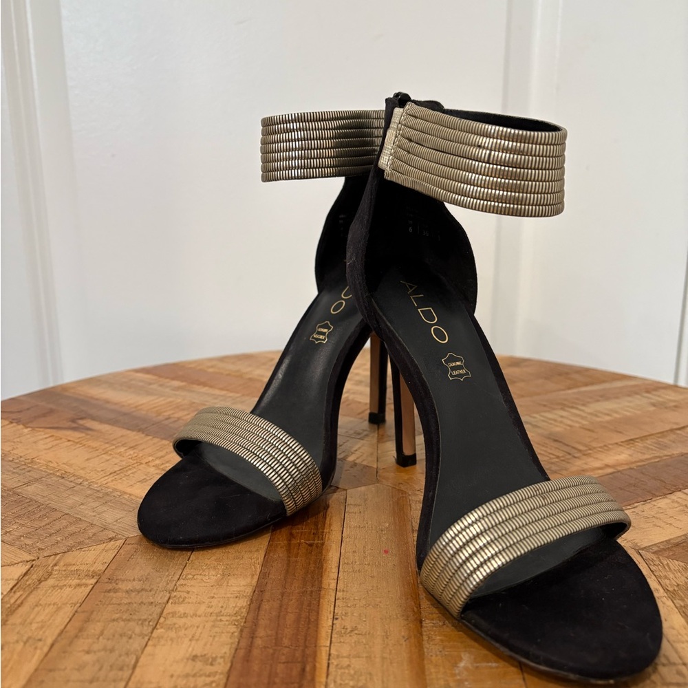 Aldo Black and Gold Heels with Tall Slender Heel and Wide Ankle Strap